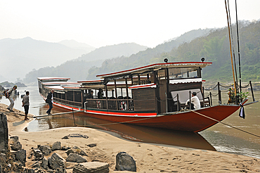 Cruise boat, owned by ' The Luang Say Lodge & Cruises', moored on the bank of Mekong River in front of the Luang Say Lodge at Pakbeng, Oudomxay Province, Laos, Southeast Asia