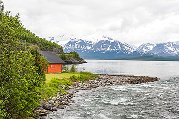 The Nordmannvikdalen River mouth into the Lyngen fjord,County of Troms,Norway,Northern Europe