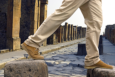 Stepping stones above perpetually flowing water needed to cross streets and keep the way clear for carts, archaeological site of Pompeii, UNESCO World Heritage Site, province of Naples, Campania, Italy, Europe