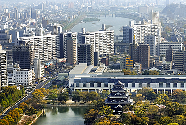 Hiroshima Castle called Carp Castle in the foreground was destroyed in the atomic bomb blast of August 6, 1945 and rebuilt in 1958, Hiroshima, Japan