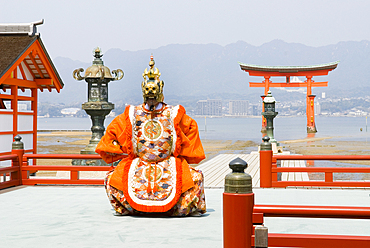 Dance ceremony 'Bugaku' on a stage of the Itsukushima-jinja Shrine on the Miyajima Island, off Hiroshima, Japan