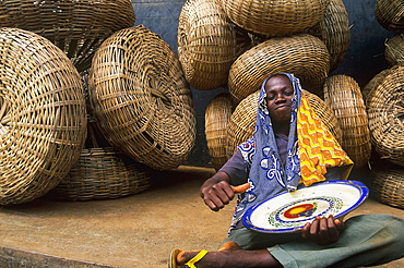 Young boy and basketwork, Benin, Gulf of Guinea, West Africa