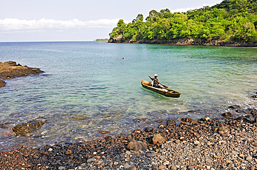 Fisherman in small cove Lagoa Azul on the north coast of Sao Tome Island, Republic of Sao Tome and Principe,Africa