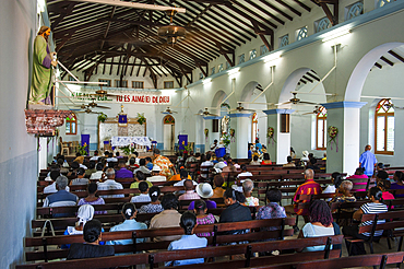 Sunday mass in the church at the village of Deshaies, Basse-terre, Guadeloupe, overseas region of France,Leewards Islands, Lesser Antilles, Caribbean
