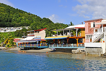 Cafe restaurant terrace on stilts, village of Deshaies, Basse-terre, Guadeloupe, overseas region of France,Leewards Islands, Lesser Antilles, Caribbean