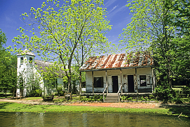 Acadian Village is a showcase of authentic homes along a winding bayou which depicts the unique Acadian architecture of the 19th century, Lafayette, Louisiana,United States of America, Americas