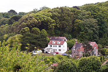 Houses at the edge of the woods in the Havelet district, St Peter Port, Guernsey Island, Bailiwick of Guernsey, United Kingdom