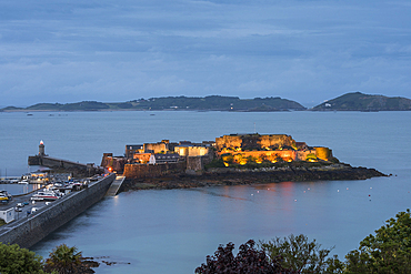 Castle Cornet at dusk standing on a former tidal island at the entrance of St Peter Port harbour, Guernsey Island, Bailiwick of Guernsey, United Kingdom