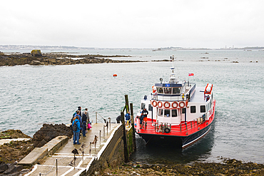 Passengers embarking at Rosiere Steps on the Travel Trident ferry boat to Guernsey from Herm Island, Bailiwick of Guernsey, United Kingdom