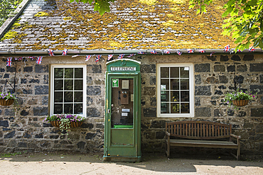 Old telephone booth located near the Visitor Center of Sark island, Channel Islands, Bailiwick of Guernsey, United Kingdom