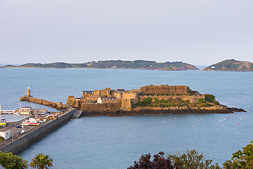 Castle Cornet at dusk standing on a former tidal island at the entrance of St Peter Port harbour, Guernsey Island, Bailiwick of Guernsey, United Kingdom
