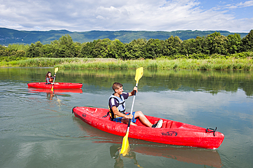 Canoeing on a section of Vieux Rhone River near Motz in Chautagne region,Savoie, Rhone-Alpes region, France, Europe
