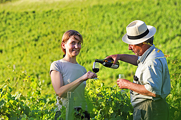 Veronique Dupasquier, wine grower, tasting wine in the vineyard at Jongieux, Savoie department, Rhone-Alpes region, France, Europe