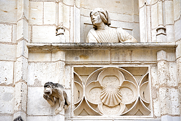 Statue (probably Jacques Coeur) on the balcony of a false window of the exterior facade of the Jacques Coeur's palace, Bourges, Cher department, Province of Berry, Centre-Val de Loire region, France