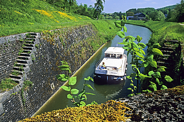 Lock crossing on the canal of the Meuse River,Ardennes departement,Champagne-Ardenne region,Northern France,Europe