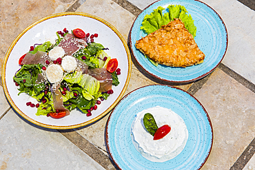 Dishes served at the Castle restaurant, located in an old fortress (Lekursi) overlooking the bay of Saranda, Albania, Europe