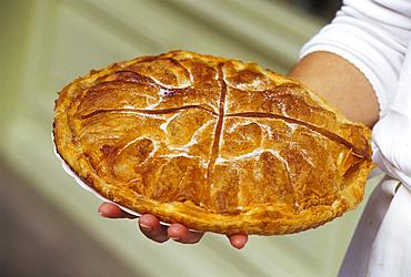 Martine Crespo showing a sweet croustade at Saint-Girons, province of Couserans, Ariege department, Occitanie region,France,Europe