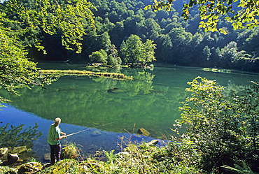 Young angler by the Bethmale lake in the Couserans province, Ariege department, Occitanie region,France,Europe