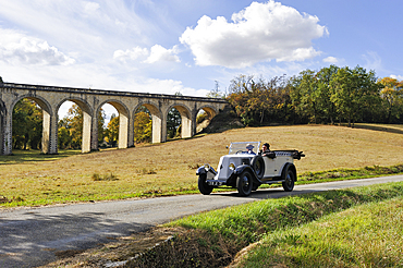Drive with an open touring vintage car (Renault 1925) around Auch.Gers department, Occitanie region, southwest of France,Europe