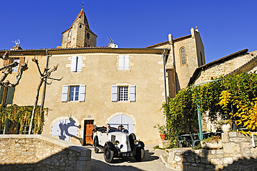 Drive with an open touring vintage car (Renault of 1925) at Lavardens,Gers department, Occitanie region, southwest of France,Europe
