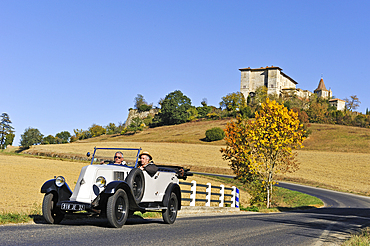 Drive with an open touring vintage car (Renault of 1925) around Lavardens,Gers department, Occitanie region, southwest of France,Europe