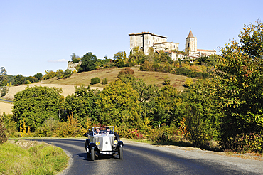 Drive with an open touring vintage car (Renault of 1925) around Lavardens,Gers department, Occitanie region, southwest of France,Europe