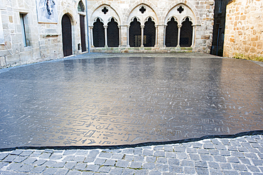 Giant copy of the Rosetta stone, sculpted in granit by the American conceptual artist Joseph Kosuth, on the 'Place des Ecritures' (writings Place) in the city of Figeac, Lot department, region of Midi-Pyrenees, Occitanie, southwest of France, Europe