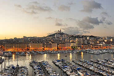 Old Port at dawn with the Basilica Notre-Dame de la Garde,Marseille,Bouches-du-Rhone department,Provence-Alpes-Cote d'Azur region,France,Europe