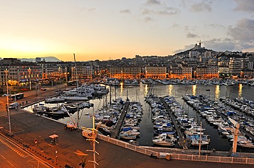 Old Port at dawn with the Basilica Notre-Dame de la Garde,Marseille,Bouches-du-Rhone department,Provence-Alpes-Cote d'Azur region,France,Europe