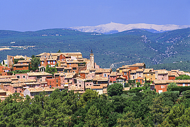 Roussillon one of the most beautiful villages of France with the Mont Ventoux in background, Luberon Massif,Vaucluse department,Provence-Alpes-Cote d'Azur region,southeast of France,Europe
