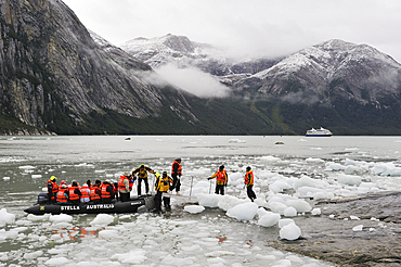 Passengers from Stella Australis cruise-ship landing to view Pia Glacier, Cordillera Darwin, Northeast branch of the Beagle Channel, Tierra del Fuego, Patagonia, Chile, South America