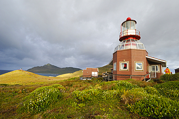 Lighthouse of Horn island with Cape Horn in the background, Tierra del Fuego, Patagonia, Chile, South America