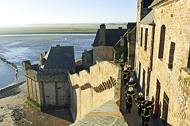 Firemen in training on the ramparts of Mont-Saint-Michel, Manche department, Normandy region, France, Europe