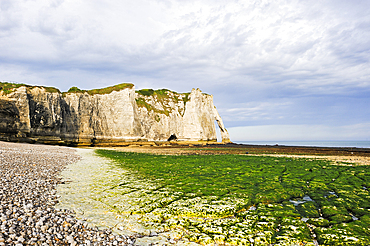 Foreshore at low tide and cliff, Etretat, Seine-Maritime department, Normandy region, France, Europe