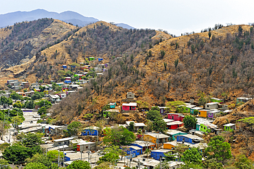 Colorful houses in a poor area on the hillside around Santa Marta, department of Magdalena, Caribbean Region, Colombia, South America