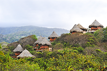 Bungalows of Ecohabs hotel overlooking the Carnaval beach, Tayrona National Natural Park, Department of Magdalena, Caribbean Region, Colombia, South America