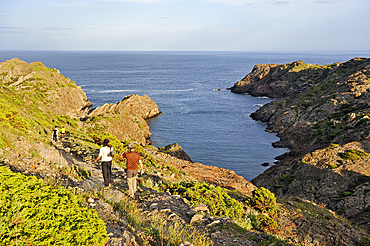 Hikers at Cala Fredosa creek, Cap Creus, Costa Brava, Catalonia, Spain, Europe