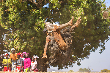 Masked dancer somersaulting, The Kulamba Traditional Ceremony of the Chewa people from Zambia, Mozambique and Malawi, held annually on the last Saturday in August to pay homage to their Chief Kalonga Gaia Uni, held near Katete, Eastern Province, Zambia, Africa