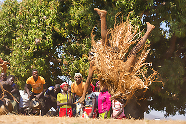 Masked dancer somersaulting, The Kulamba Traditional Ceremony of the Chewa people from Zambia, Mozambique and Malawi, held annually on the last Saturday in August to pay homage to their Chief Kalonga Gaia Uni, held near Katete, Eastern Province, Zambia, Africa