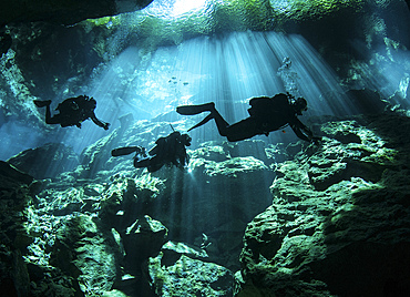 Diver enters the cavern system at Chac Mool cenote in the Riviera Maya area of Mexico's Yucatan Peninsula.
