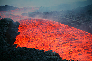November 2006 - Lava flow at nightfall during eruption of Mount Etna volcano, Sicily, Italy.