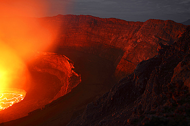 January 21, 2011 - Nighttime view of summit caldera with lava lake, Nyiragongo Volcano, Democratic Republic Congo.