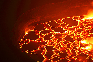 January 21, 2011 - Lava rafts floating on lava lake in summit caldera, Nyiragongo Volcano, Democratic Republic of the Congo.