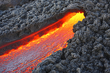 December 23, 2007 - Lava flowing from small tunnel on flank of Pacaya volcano, Guatemala.