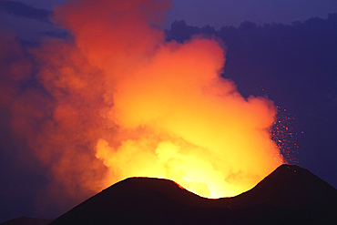 January 24, 2012 - Lava in crater glowing during blue hour on Nyamuragira Volcano, Kimanura Eruption.