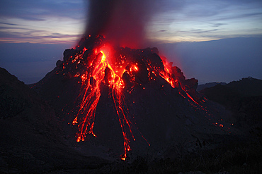 November 30, 2012 - Glowing Rerombola lava dome of Paluweh (or Rokatenda) volcano during eruption in 2012, Flores, Indonesia.