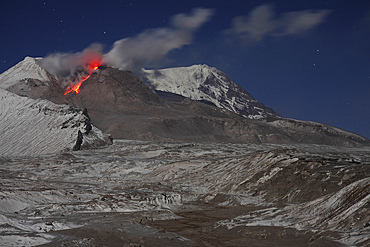 October 21, 2013 - Nighttime view of incandescent rockfall of glowing lava down flank of lava dome of Shiveluch Volcano, Kamchatka, Russia.