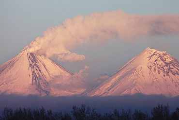 October 24, 2013 - Eruption of Kliuchevskoi (Klyuchevskoy) Volcano, Kamchatka, Russia, seen in evening light. Ash cloud is produced by the activity. Kamen volcano is seen on right.