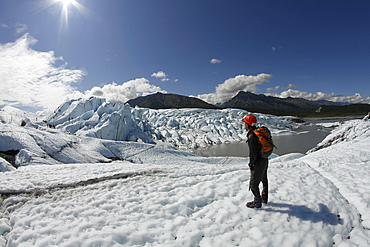 Person hiking on Matanuska Glacier, Alaska.