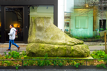 Statue of giant foot on Rue Jacques Callot on winter day